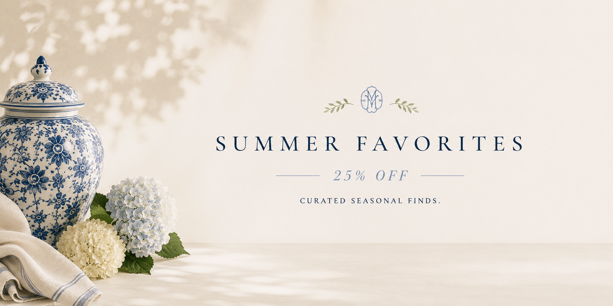 Summer Favorites sale collection at Oh, Meredith featuring blue and white home décor, luxury candles, jewelry, entertaining essentials, books, floral arrangements, and seasonal boutique gifts at 25% off.