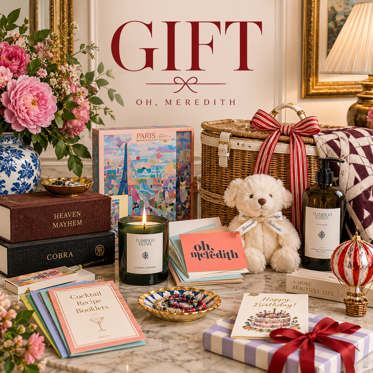 Oh, Meredith Gift collection graphic featuring curated gift items including a candle, greeting cards, puzzle, teddy bear, picnic basket, body wash, books, and wrapped present in an elegant styled scene.