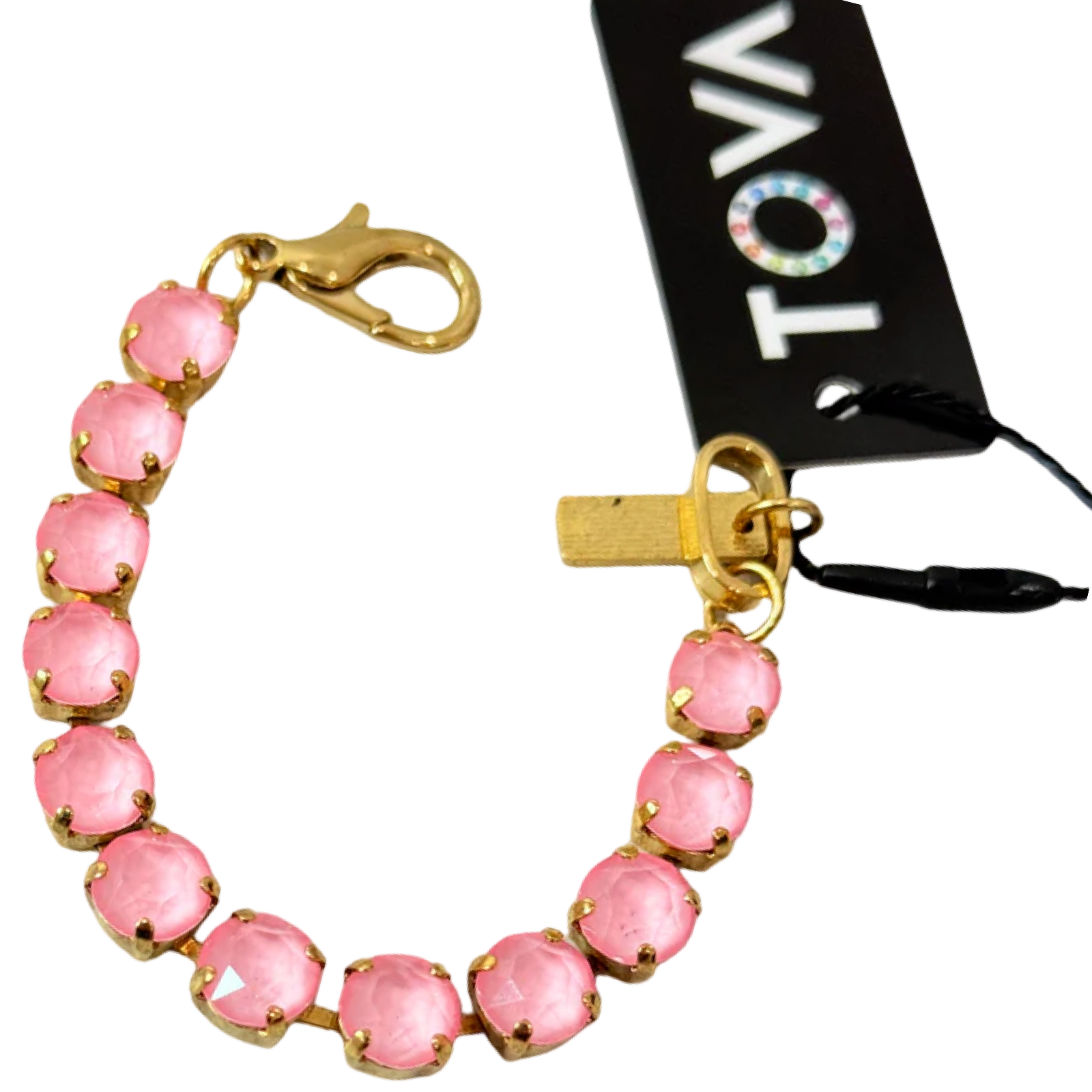 Pink beaded bracelet with gold accents and a black tag with 'Tova' branding.