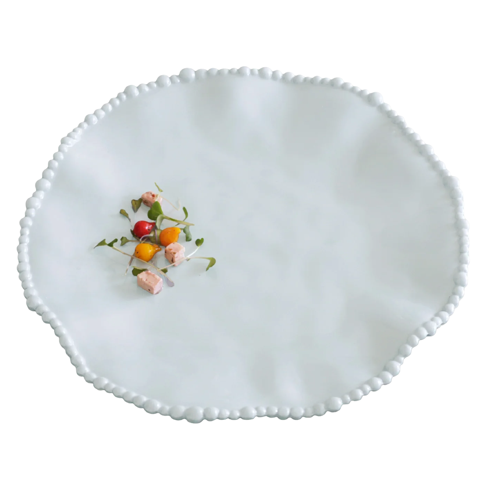White decorative plate with small colorful flowers on a white background