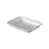 White ceramic serving dish with decorative edge on a white background