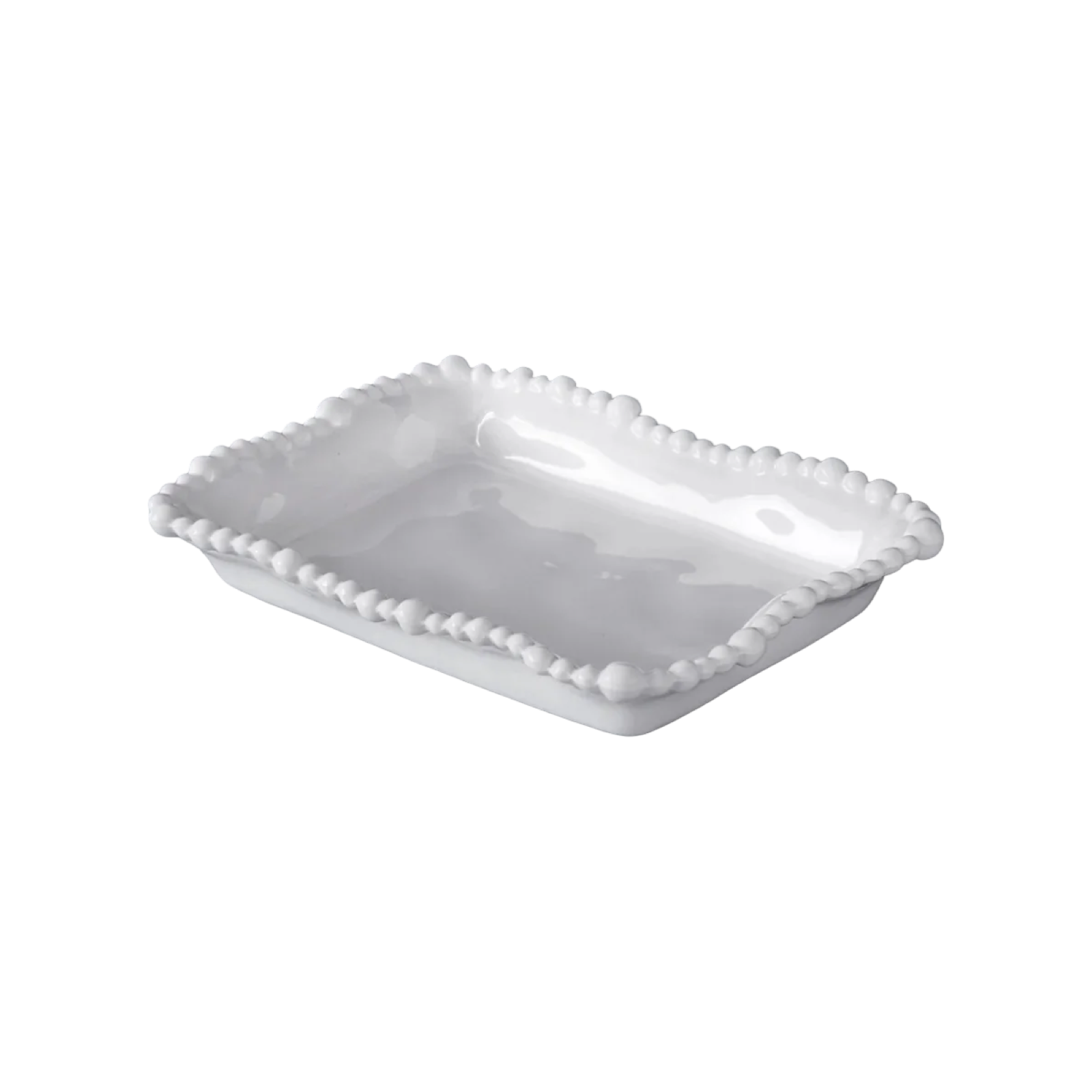 White ceramic serving dish with decorative edge on a white background