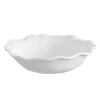White ceramic bowl with scalloped edge on a white background