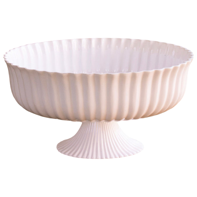 Decorative bowl with ribbed design on a white background