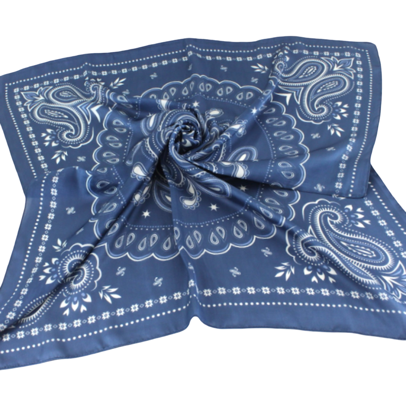 A square blue bandana scarf with a white paisley pattern, styled in a central swirl on a plain white background.