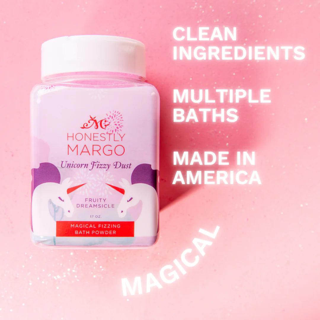 Bottle of 'Honestly Margo' unicorn fizzy dust on a pink background with text about product features.