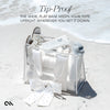 Clear tote bag with white shoes and accessories on a sandy surface, with text about the bag's design.