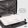 Black suitcase with white packing cubes inside, designed to fold flat for packing.