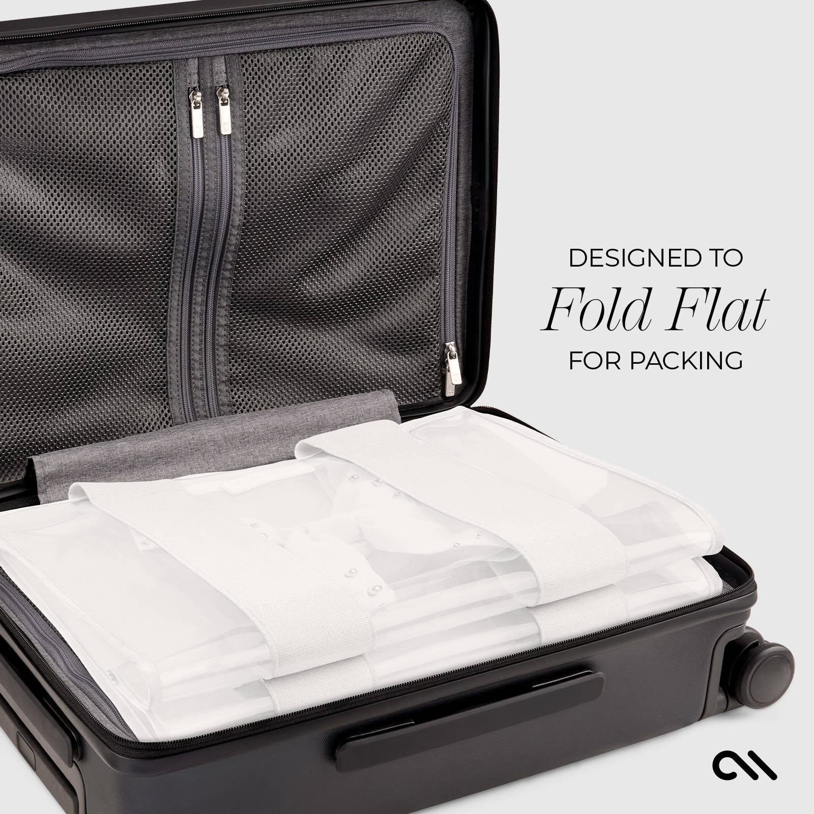 Black suitcase with white packing cubes inside, designed to fold flat for packing.