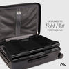 Black suitcase with a flat-packable feature on a light gray background