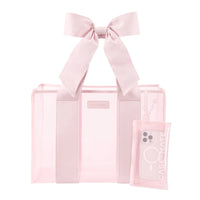 Pink tote bag with a bow and phone case on a white background