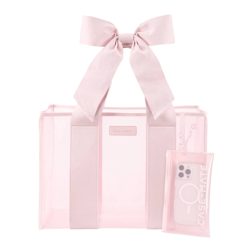 Pink tote bag with a bow and phone case on a white background