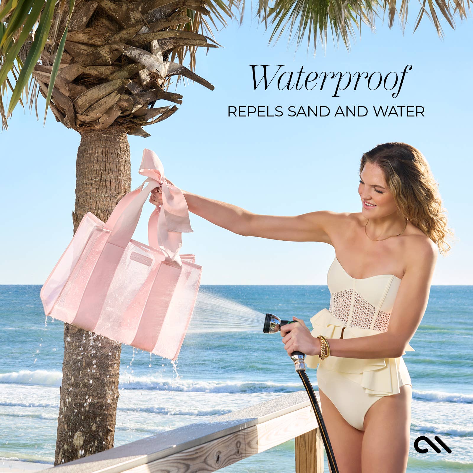 Woman at the beach holding a pink bag and a hose, with text about waterproof properties.