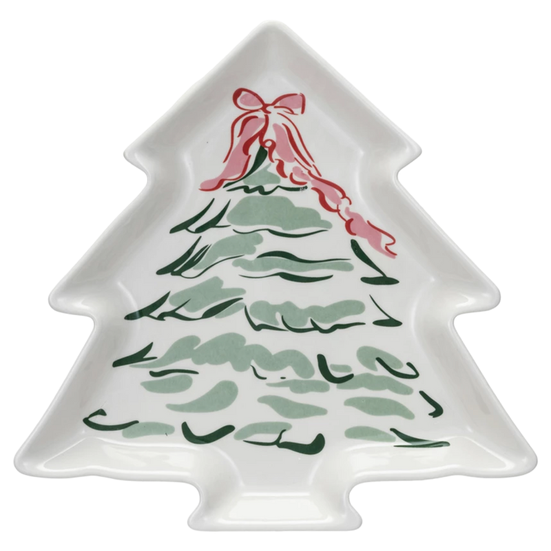 Christmas tree-shaped plate with a red bow on a white background