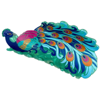 A decorative peacock figurine with a vibrant teal and blue body, a bright pink chest, and a large fanned tail displaying blue, green, orange, and purple eye-like patterns, isolated on a white background.