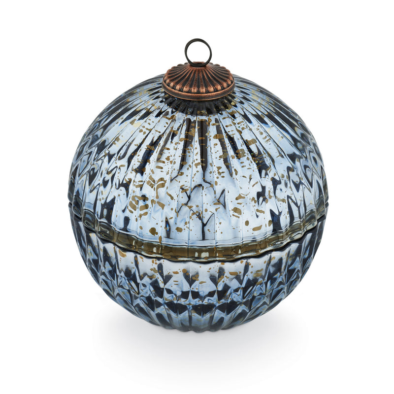 Decorative spherical box with intricate design and metallic lid on a white background