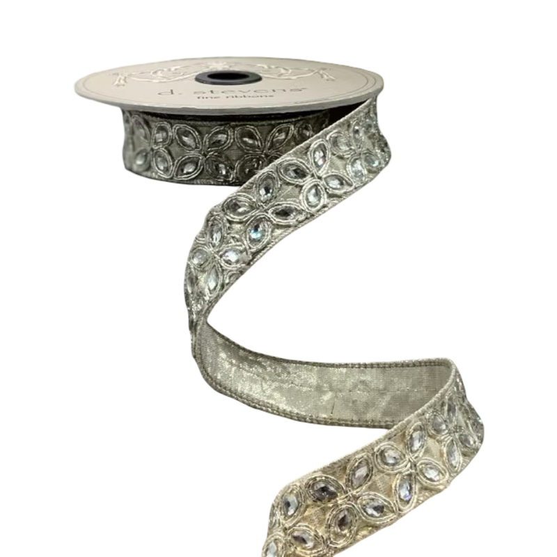 Decorative ribbon with gemstone-like embellishments on a white background