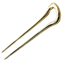 Ficcare Sara Chignon Hair Pin in shiny gold with sculptural U-shaped design for securing buns and partial updos.