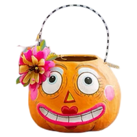 Glitterville Pumpkin Betty and Gossip Gourdy orange papier-mâché Halloween buckets with colorful hand-painted faces and striped handles.
