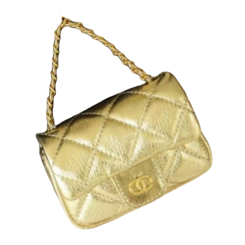 A small quilted metallic gold handbag with a chain strap and a gold interlocking CC logo on the front, isolated on a white background.