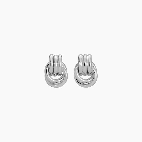 Pair of silver hoop earrings on a white background