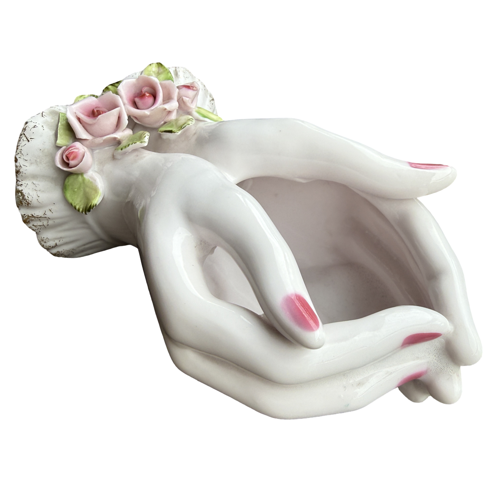 Decorative ceramic planter shaped like a woman's torso with floral hair on a white background