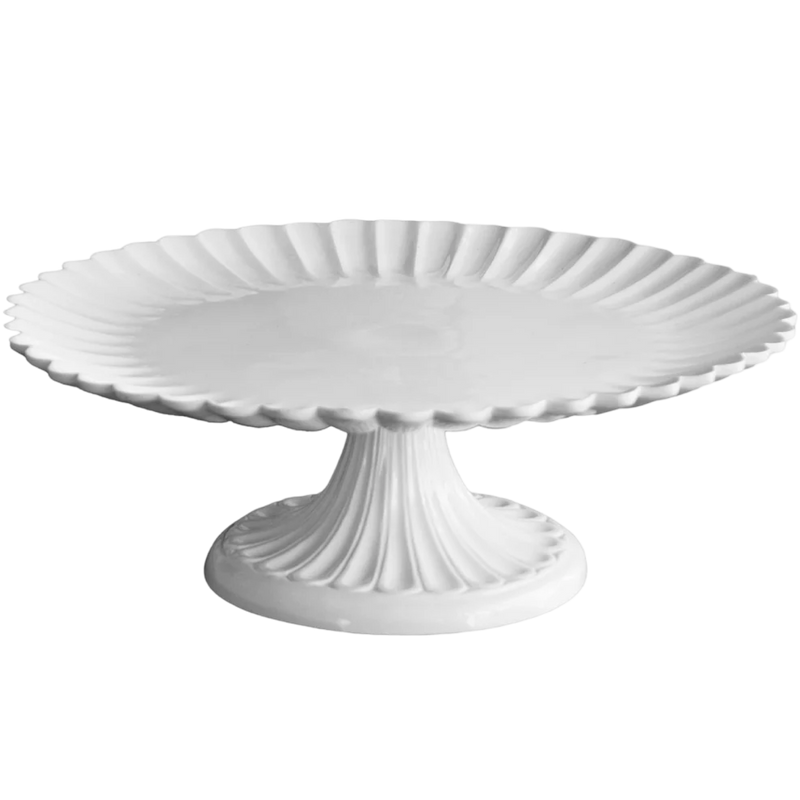 White decorative cake stand on a white background