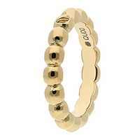 Gold ring with beaded design on a white background