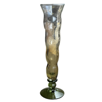 Tall, ribbed glass vase on a white background