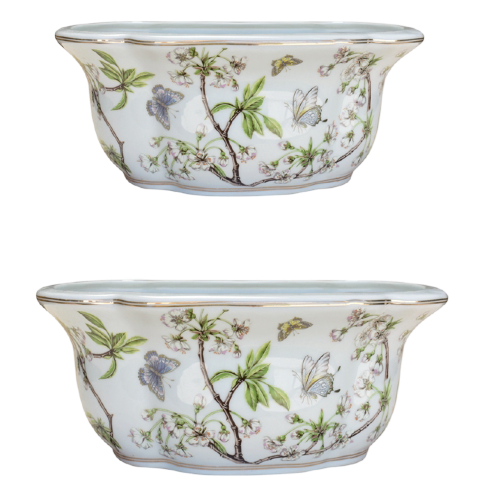 Two ceramic planters with floral and butterfly design on a white background