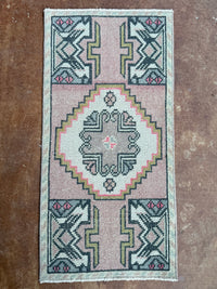 Small rug with geometric pattern on a textured surface