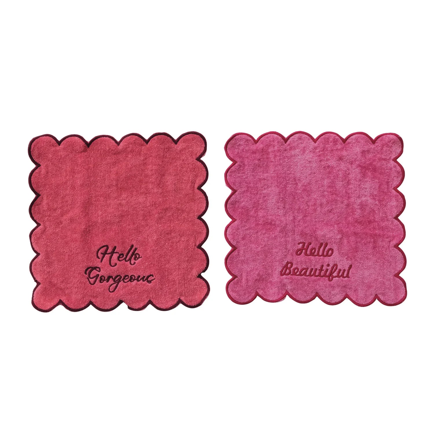 Two pink coasters with scalloped edges and text on a white background