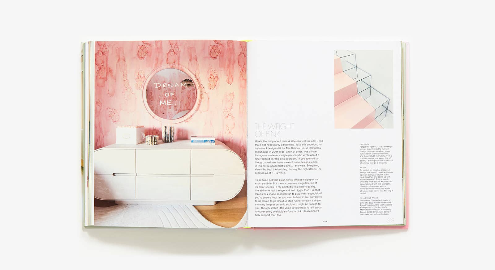 Open book showing a interior design layout with a bed and mirror.