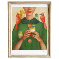 Framed artwork of a woman with birds on her shoulders and green dress.