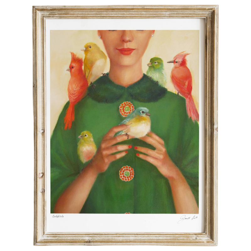 Framed artwork of a woman with birds on her shoulders and green dress.