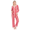 Woman wearing a red and pink star-patterned pajama set on a white background