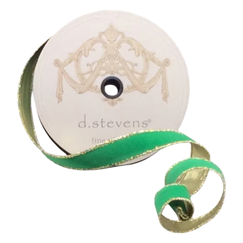 Kelly green flocked velvet ribbon with metallic gold backing and gold edging, 1 inch wide, shown curled beside a 25-yard spool for bows, ornaments, wreaths, and gift wrapping.