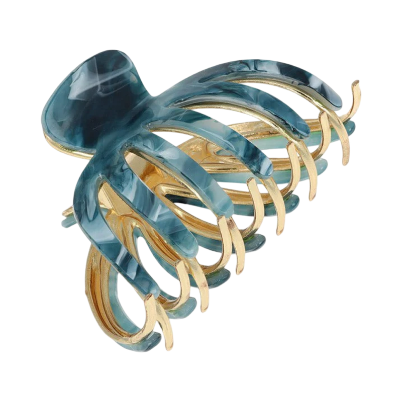 Blue and gold hair clip on a white background