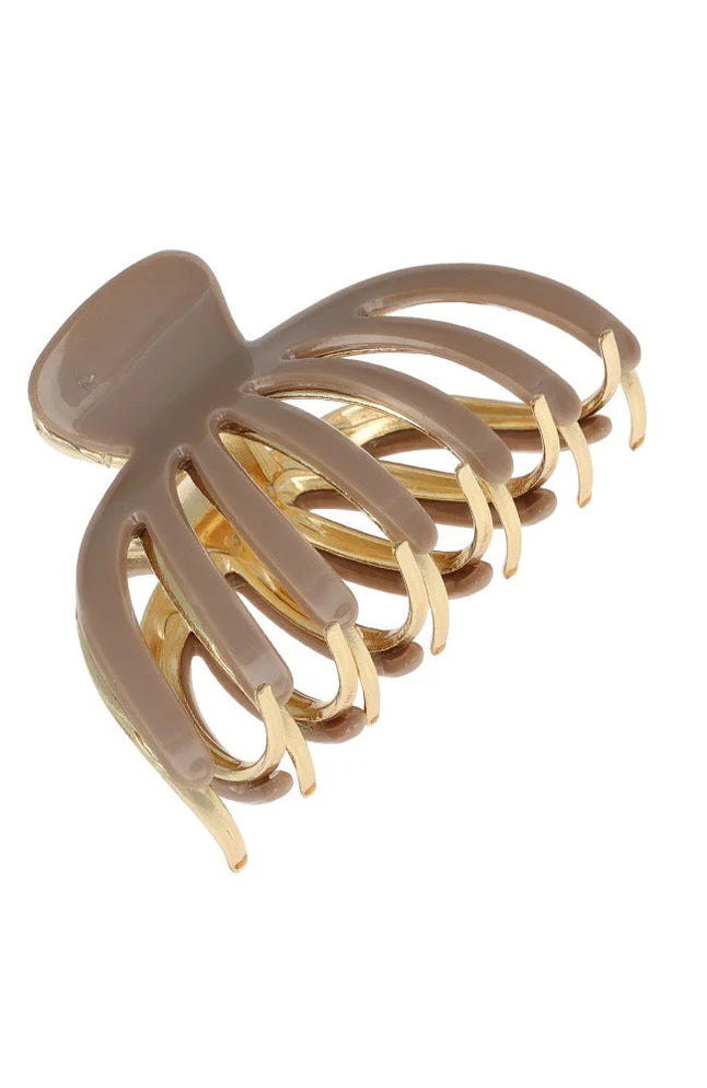 Beige hair clip on a white background