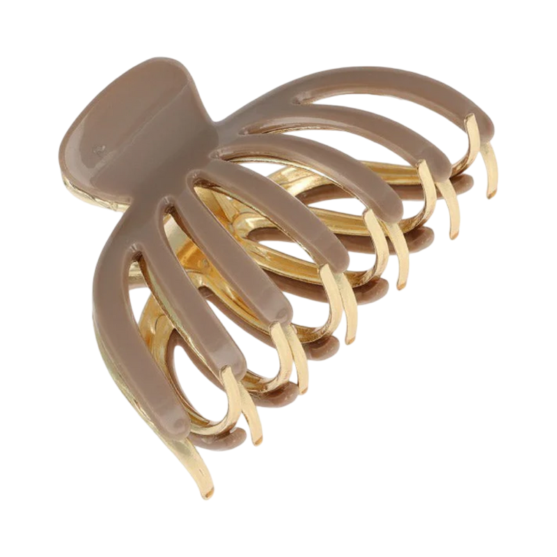 Beige and gold hair claw on a white background