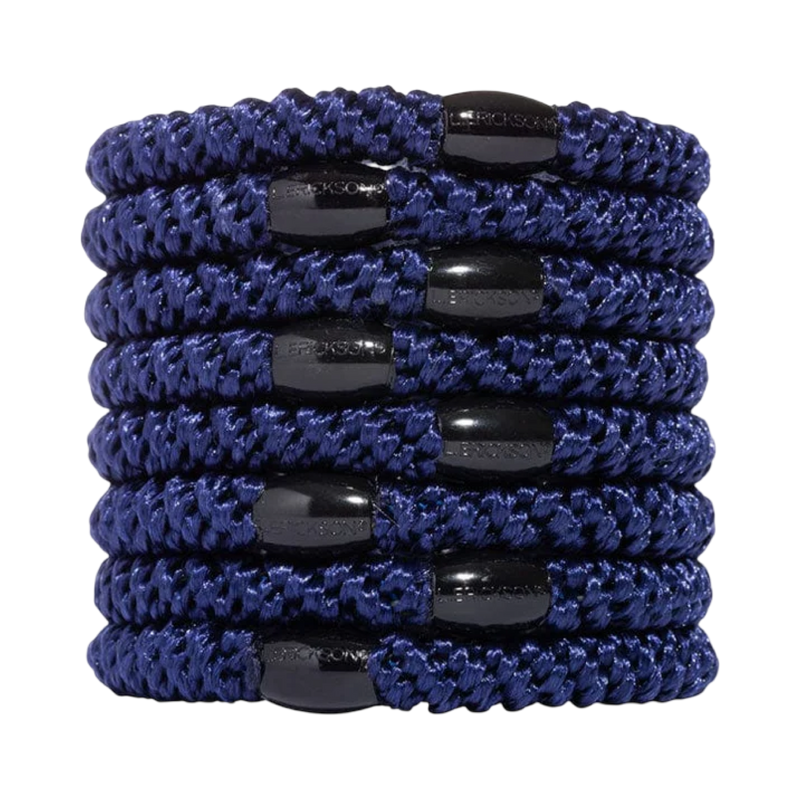 Set of blue hair ties with black ends on a white background