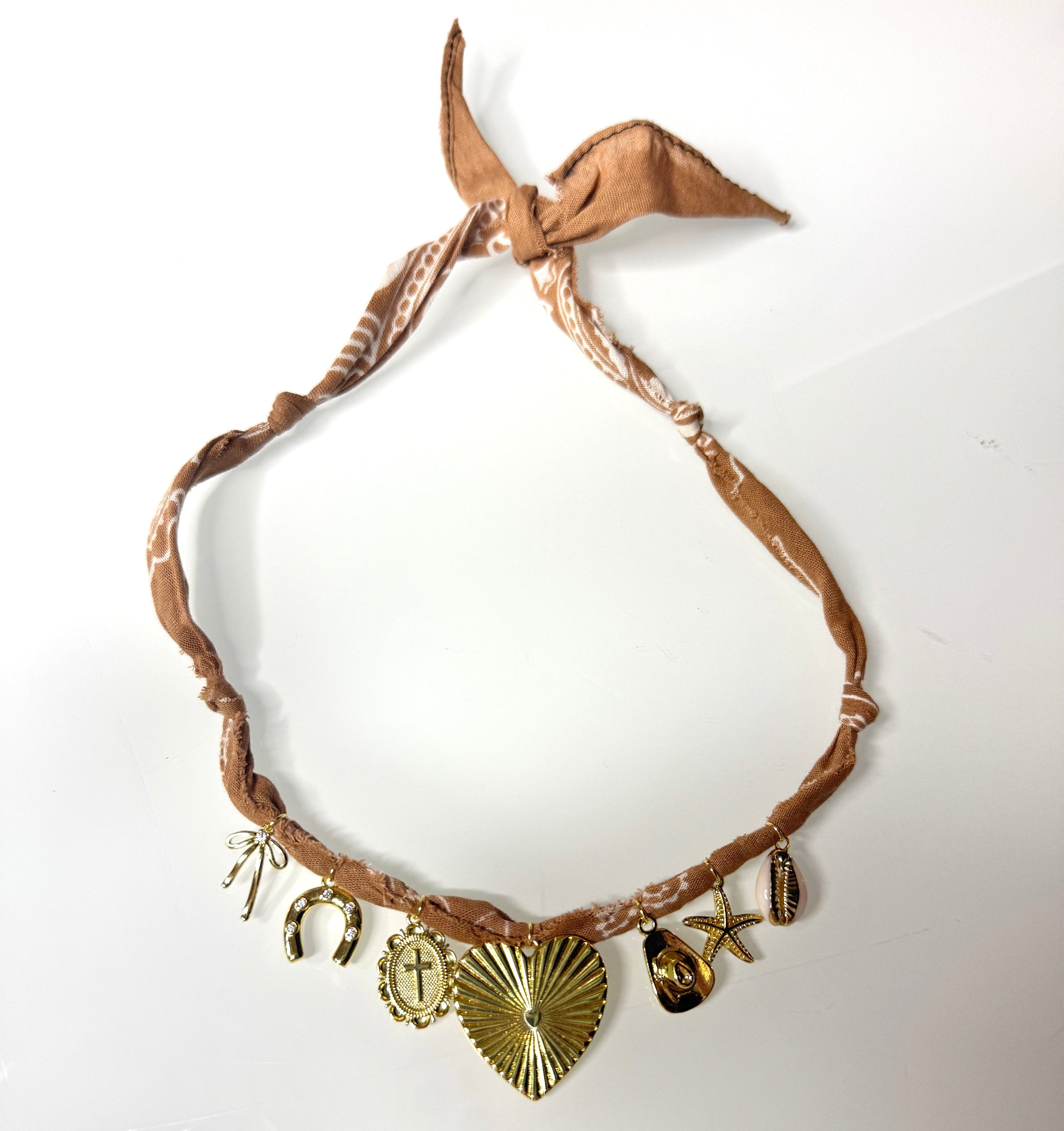 Mandriana bandana necklace, handmade charm necklace, desert chic jewelry, golden cross and heart necklace, boho talisman necklace, cowrie shell necklace, rust bandana jewelry, starfish and horseshoe necklace, symbolic charm choker, one-of-a-kind boho accessories