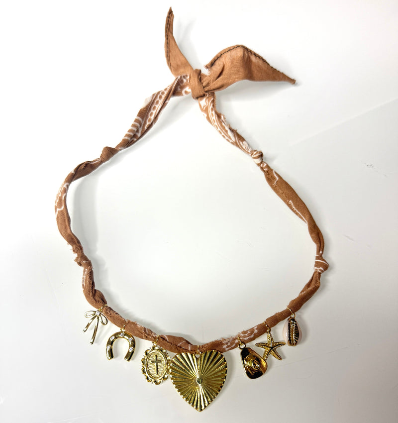 Mandriana bandana necklace, handmade charm necklace, desert chic jewelry, golden cross and heart necklace, boho talisman necklace, cowrie shell necklace, rust bandana jewelry, starfish and horseshoe necklace, symbolic charm choker, one-of-a-kind boho accessories