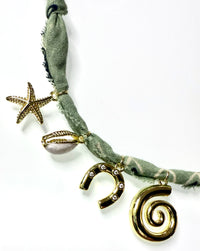 Mandriana bandana necklace, seaside charm necklace, fish and shell necklace, handmade coastal jewelry, beachy boho necklace, lucky talisman necklace, olive green bandana necklace, spiral pendant choker, gold charm necklace, boho beach accessories