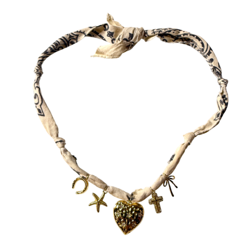 Mandriana, scarf necklace, heart charm necklace, handmade charm jewelry, beachy boho accessory, cross charm necklace, starfish necklace, symbolic jewelry, neutral bandana necklace, one of a kind statement piece, artisanal jewelry, boho chic accessories, charm scarf necklace, textured heart necklace