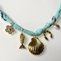 Mandriana, scarf necklace, shell charm necklace, ocean inspired jewelry, coastal style accessory, seafoam green bandana necklace, fish charm, horseshoe necklace, beachy boho jewelry, handmade charm necklace, unique summer necklace, mermaidcore accessory, one of a kind jewelry, artisanal necklace