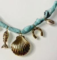 Mandriana, scarf necklace, shell charm necklace, ocean inspired jewelry, coastal style accessory, seafoam green bandana necklace, fish charm, horseshoe necklace, beachy boho jewelry, handmade charm necklace, unique summer necklace, mermaidcore accessory, one of a kind jewelry, artisanal necklace