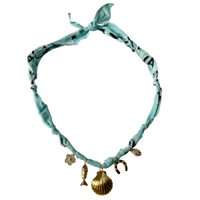 Mandriana, scarf necklace, shell charm necklace, ocean inspired jewelry, coastal style accessory, seafoam green bandana necklace, fish charm, horseshoe necklace, beachy boho jewelry, handmade charm necklace, unique summer necklace, mermaidcore accessory, one of a kind jewelry, artisanal necklace