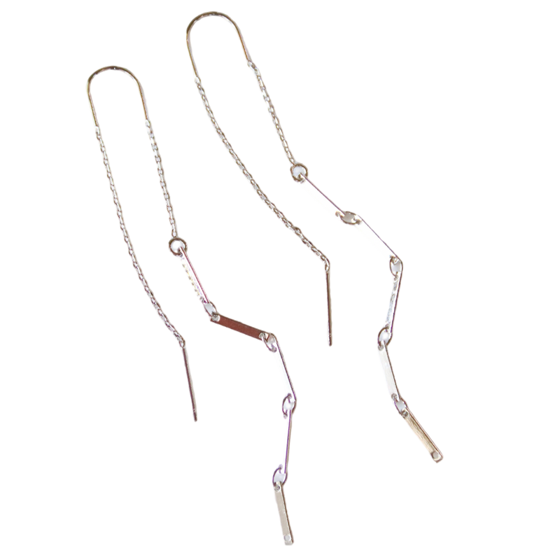 Two gold necklaces on a white background