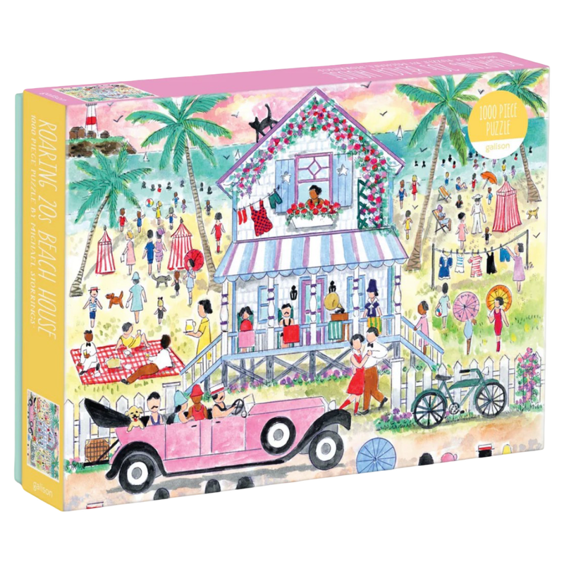 Jigsaw puzzle box with a colorful illustration of a beach house and people, featuring a pink car and palm trees.
